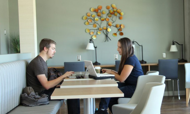 graduate students working at table