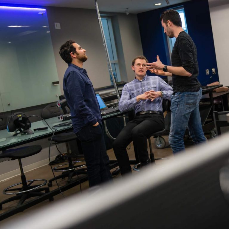 Graduate students talking in a room