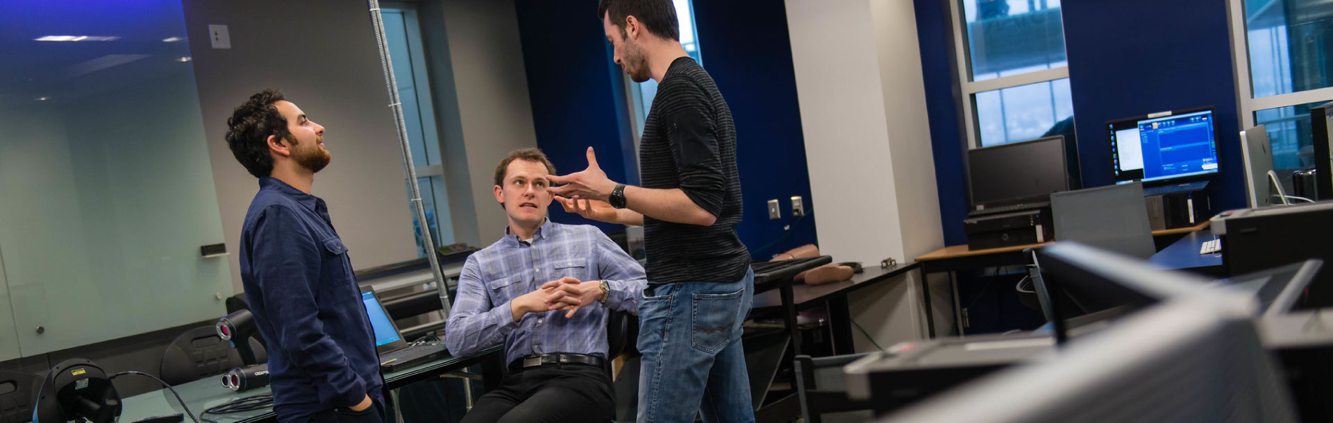 Graduate students talking in a room