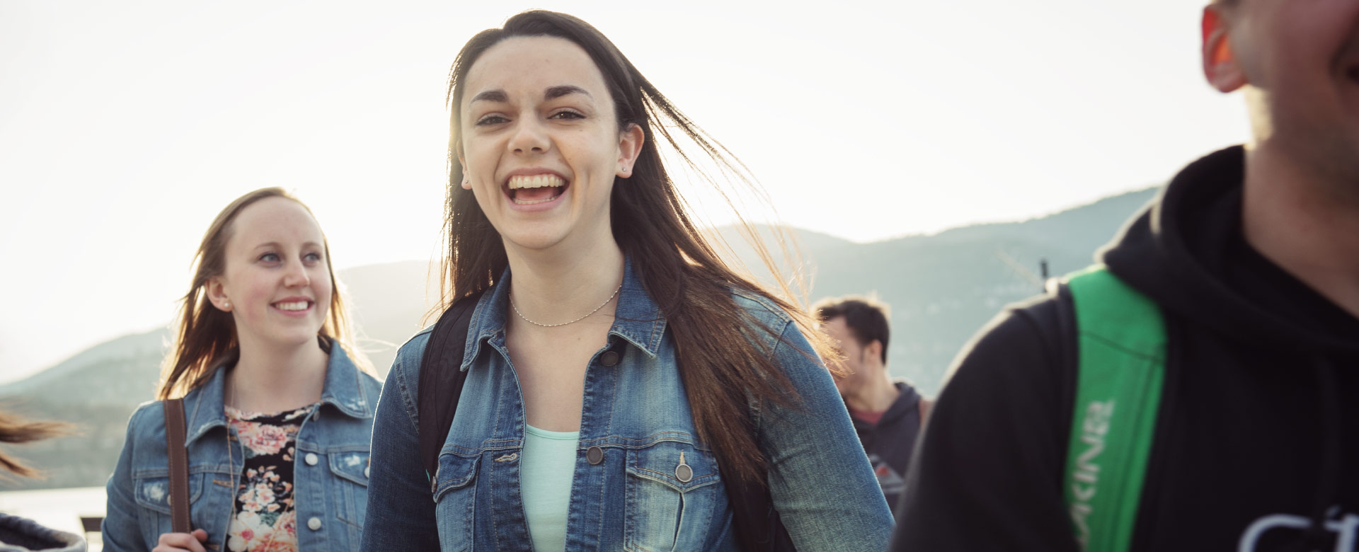 Happy students walking on campus