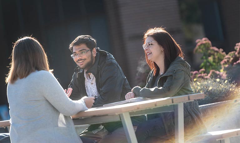 Students sitting on campus